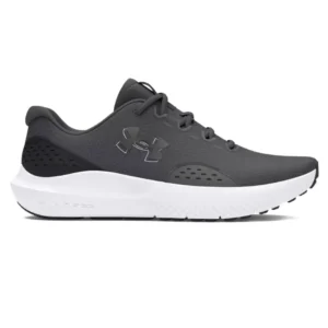 A side view of a gray athletic running shoe with a white sole and black accents, featuring the Under Armour logo.