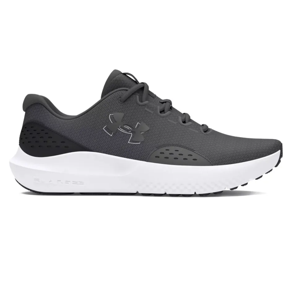 A side view of a gray athletic running shoe with a white sole and black accents, featuring the Under Armour logo.